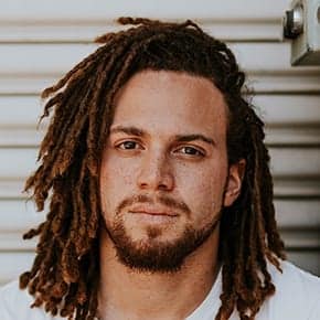 Person with dreadlocks against metal background