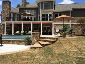 Luxurious home with pool and patio umbrellas