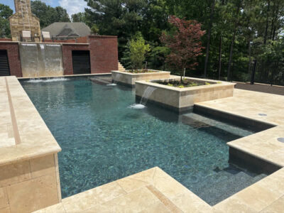 Elegant pool with cascading waterfalls and planters