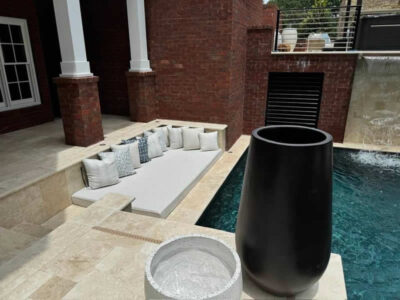 Luxury outdoor seating area by a pool