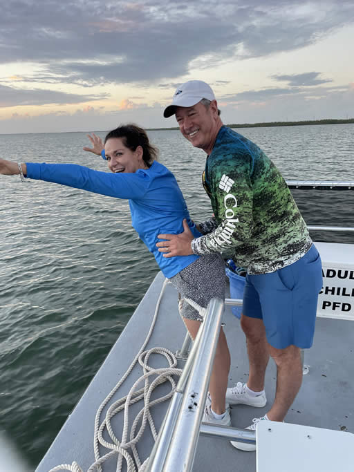Couple enjoying a boat ride on the water.