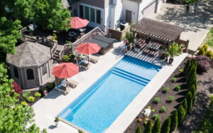 Aerial view of backyard pool, gazebo, and pergola