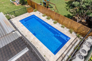 Aerial view of rectangular backyard swimming pool